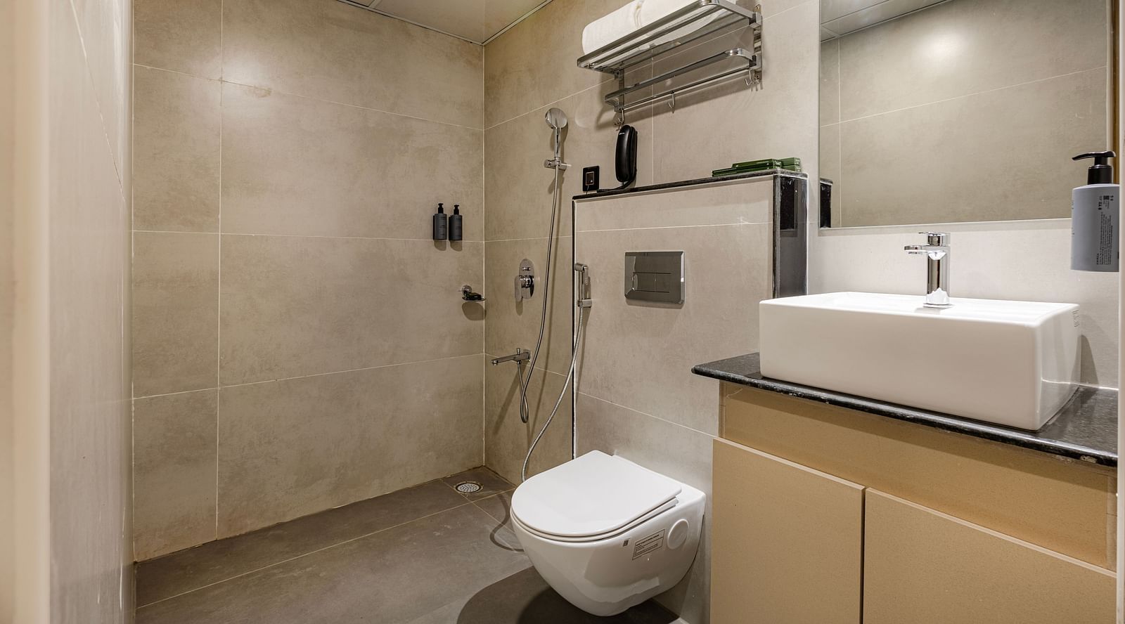 Lemonridge Hotels, KPHB | Bathroom with a sink, toilet, and shower. Clean and well-maintained facilities.